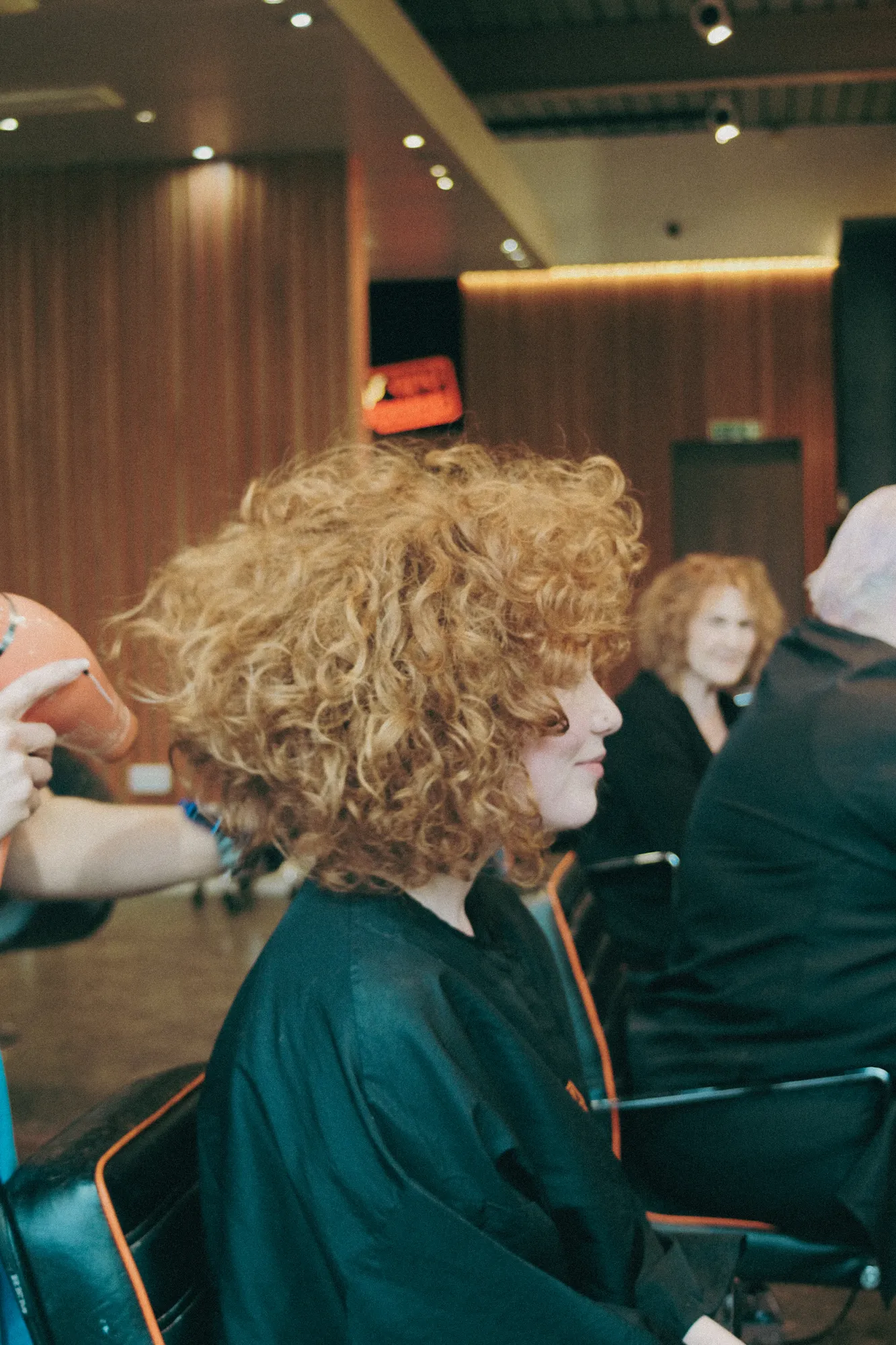 Curly hair being styled in the salon at Wigs & Warpaint, Sheffield