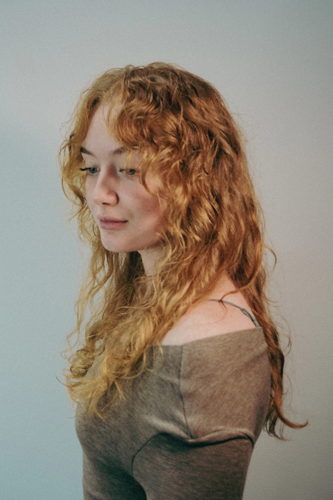 Side view of copper curly hair at Wigs & Warpaint, Sheffield