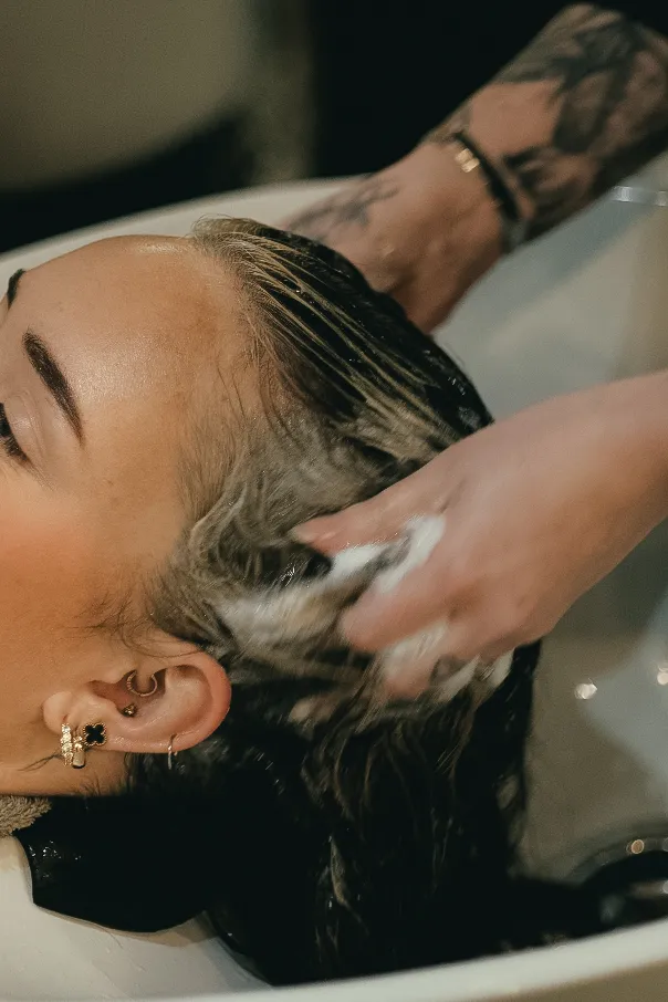 Applying a K18 molecular repair treatment at Wigs & Warpaint, Sheffield