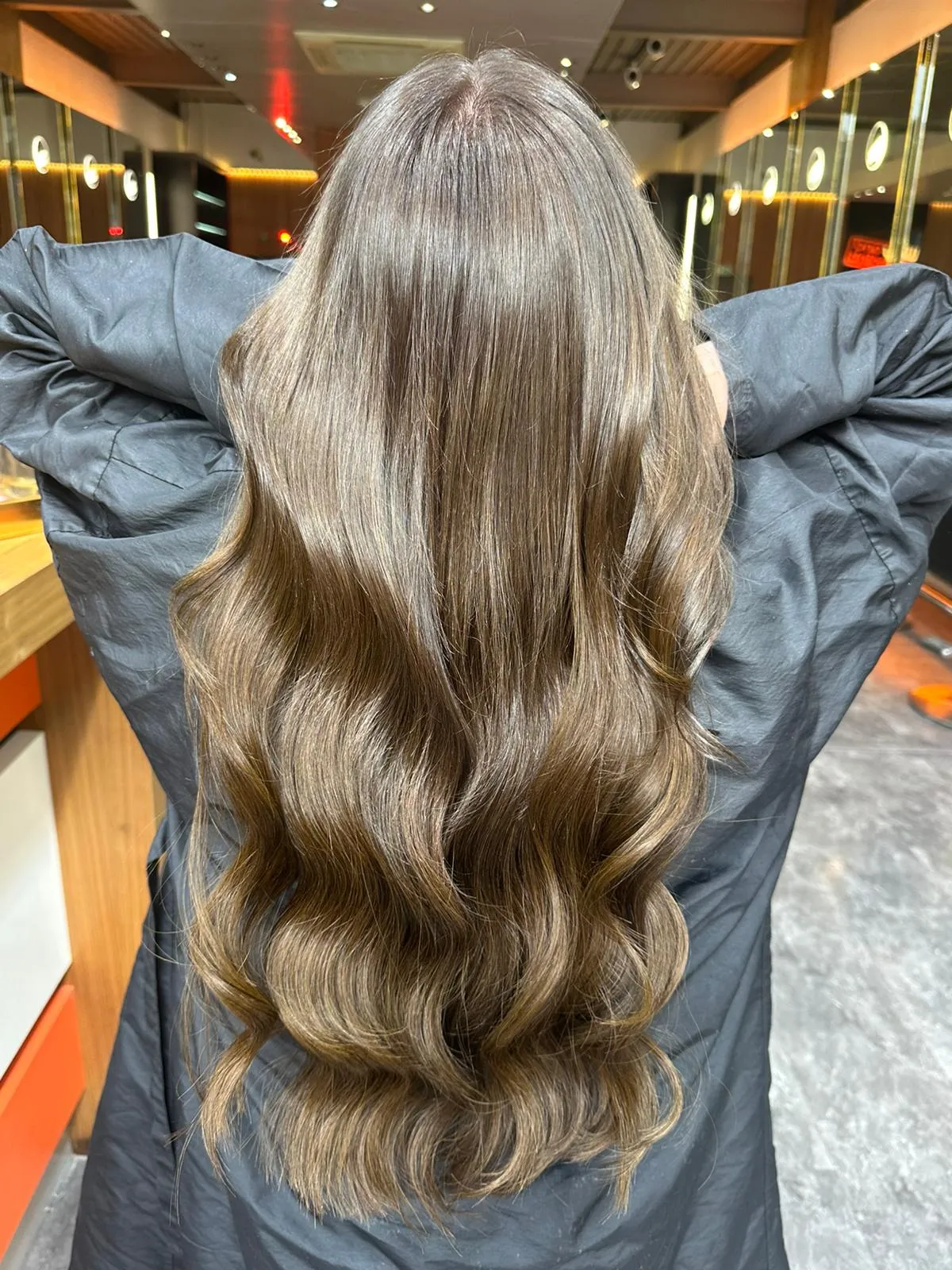 Glossy brunette hair with soft waves at Wigs & Warpaint, Sheffield