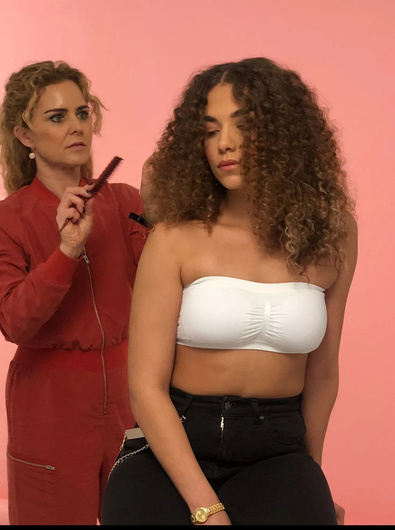 Claire checking the model’s curl shape during the PROJECT AFRO photo shoot.