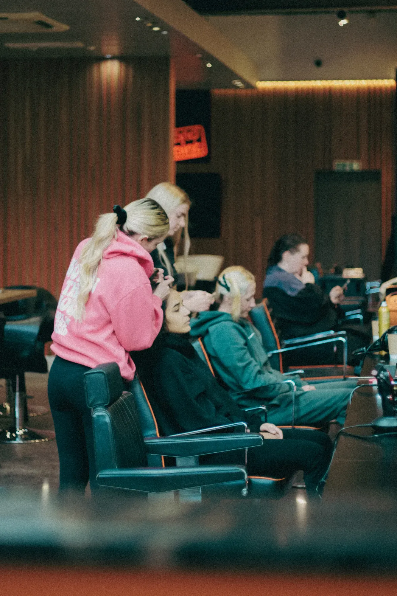 Stylists working with clients at Wigs & Warpaint in Sheffield